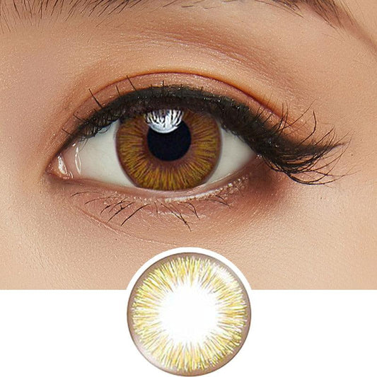 Close-up shot of model's eye adorned with Acuvue 1-Day New Define Fresh Hazel color contact lens dailies, complemented by clean eye makeup, showing the brightening effect of the hazel contact lens on dark brown eyes, above a cutout of the colour contact lens design with radial spiked pattern.