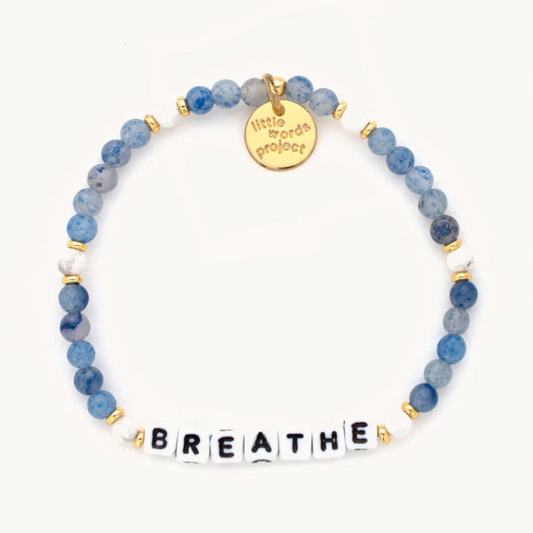 Blue bead bracelet from Little Words Project that reads, "BREATHE."