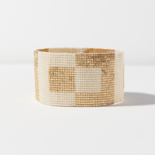 gold and white glass beaded bracelet